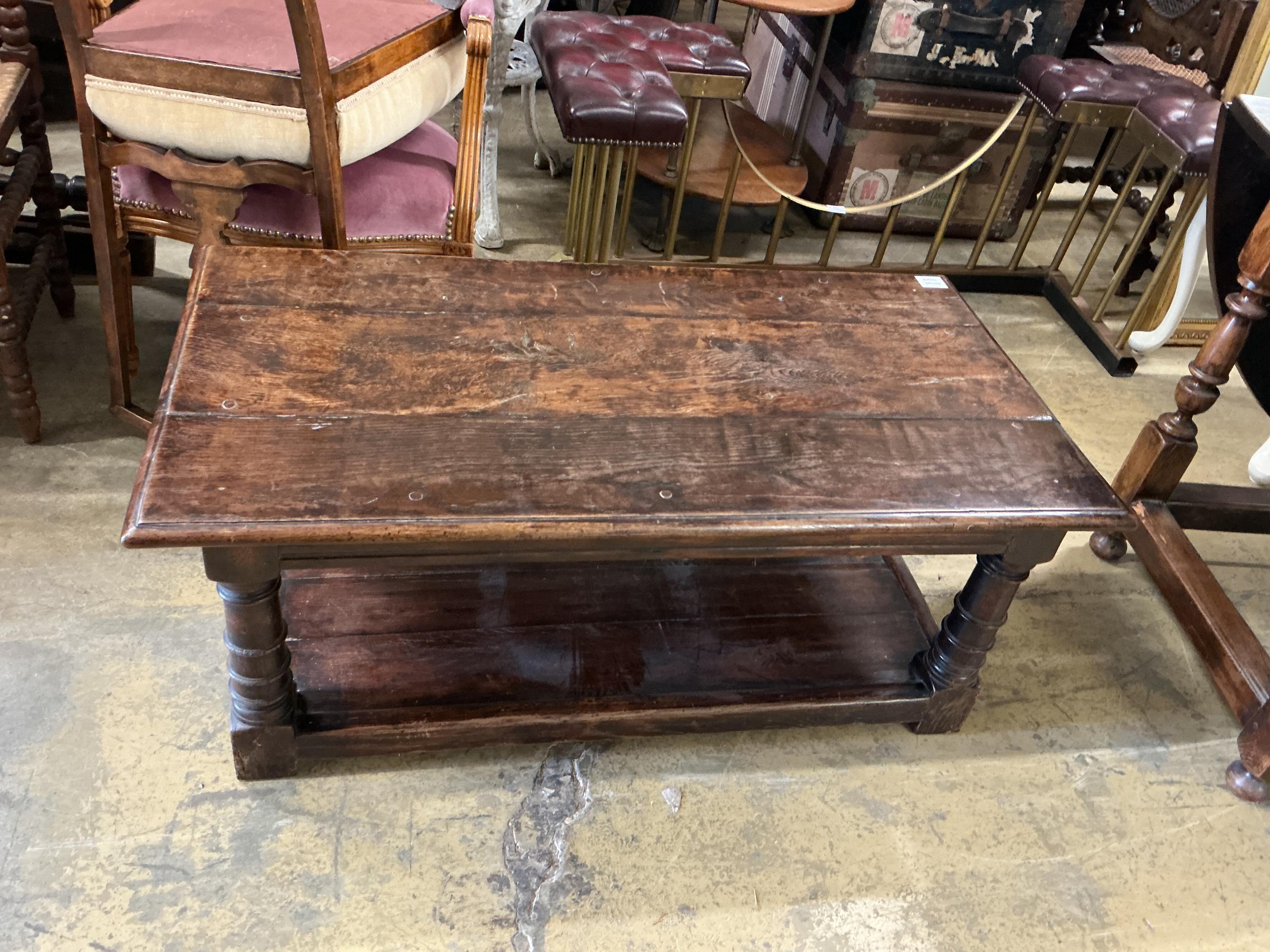 A 17th century style rectangular oak two tier coffee table, width 106c, depth 55cm, height 43cm